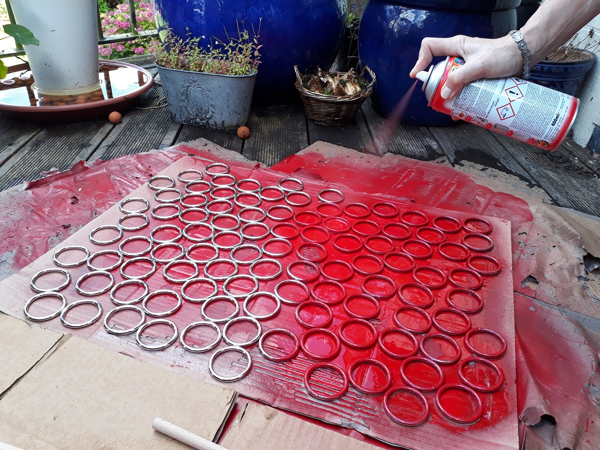 Photo of painting the attachment rings red.