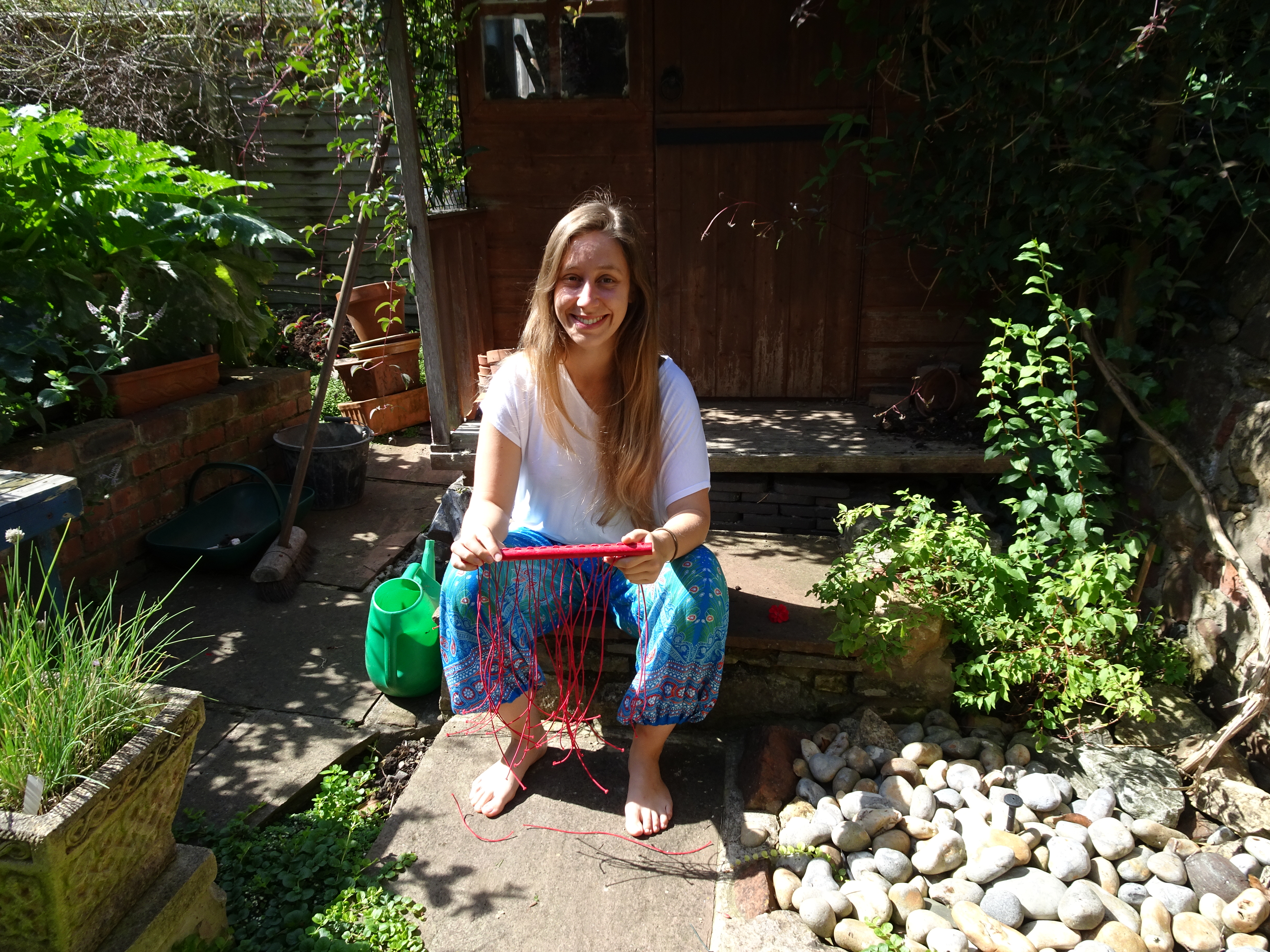 Anna threading in the garden